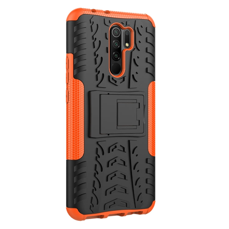 For Xiaomi Redmi 9 Tire Texture Shockproof TPU + PC Protective Case with Holder