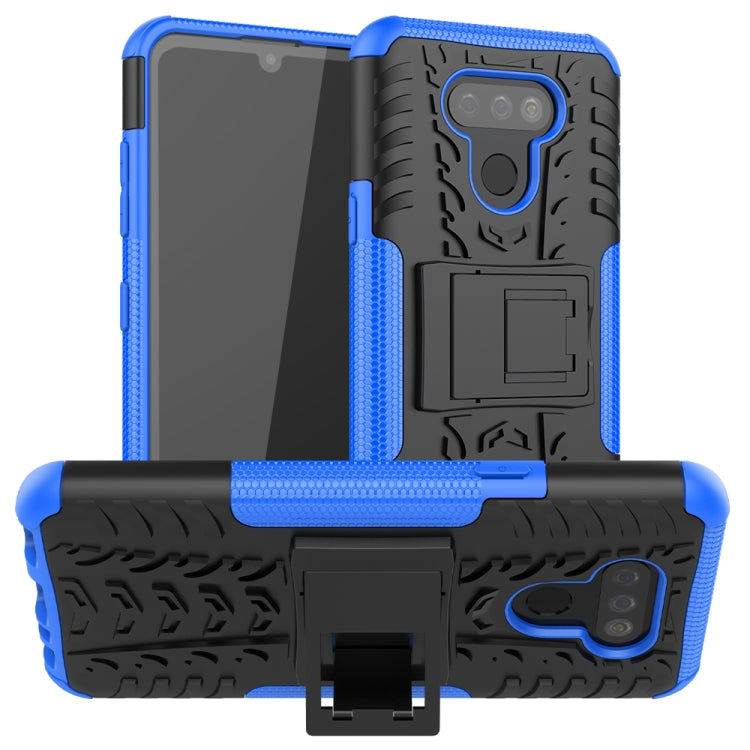 For LG Harmony 4 Tire Texture Shockproof TPU + PC Protective Case with Holder