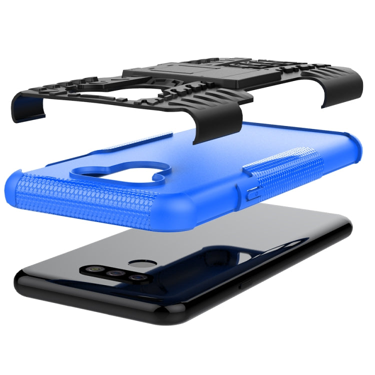 For LG Harmony 4 Tire Texture Shockproof TPU + PC Protective Case with Holder