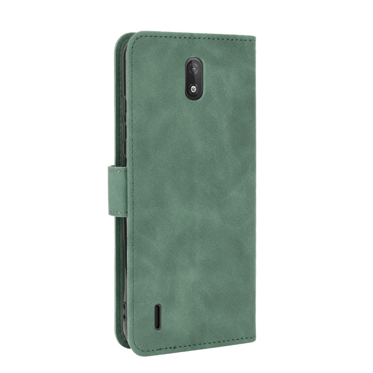 For Nokia C2 Solid Color Skin Feel Magnetic Buckle Horizontal Flip Calf Texture PU Leather Case with Holder & Card Slots & Wallet