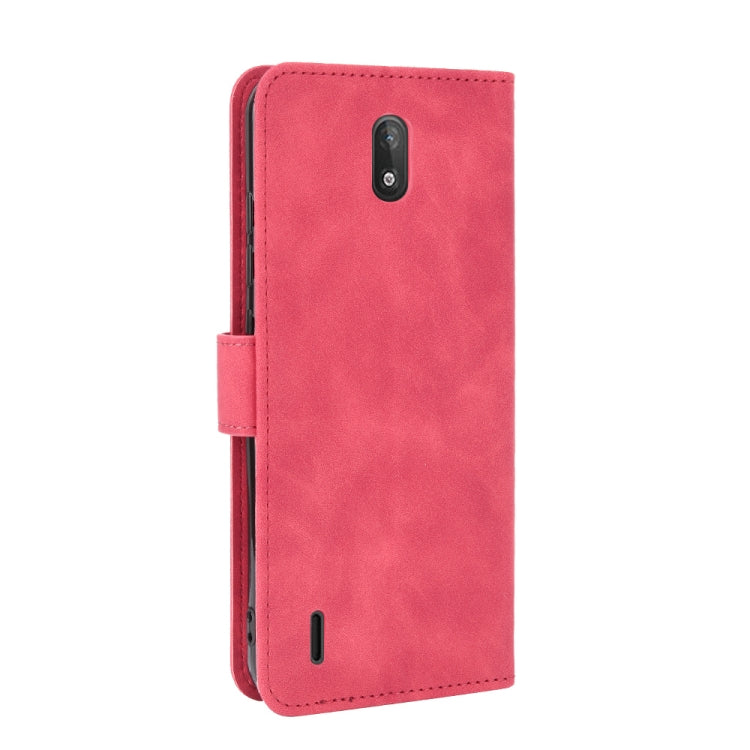 For Nokia C2 Solid Color Skin Feel Magnetic Buckle Horizontal Flip Calf Texture PU Leather Case with Holder & Card Slots & Wallet