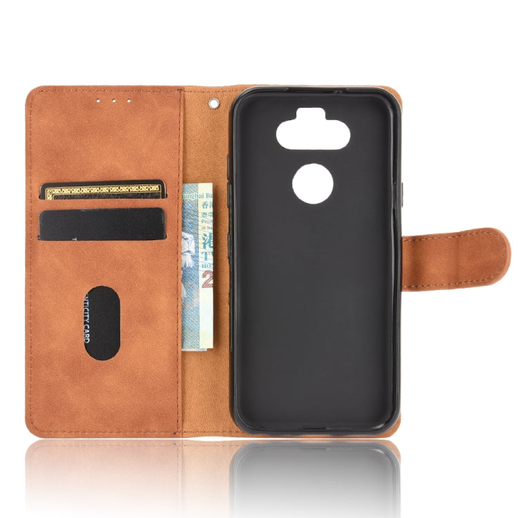 For LG K31 / Aristo 5 Solid Color Skin Feel Magnetic Buckle Horizontal Flip Calf Texture PU Leather Case with Holder & Card Slots & Wallet