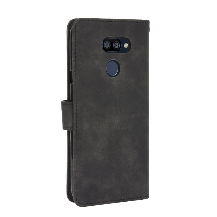 For LG K40S Solid Color Skin Feel Magnetic Buckle Horizontal Flip Calf Texture PU Leather Case with Holder & Card Slots & Wallet