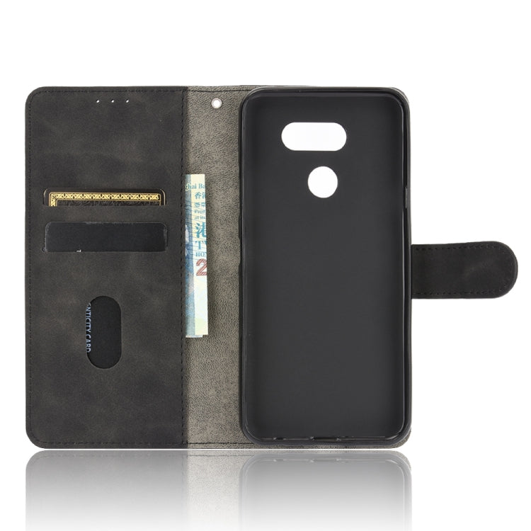 For LG K40S Solid Color Skin Feel Magnetic Buckle Horizontal Flip Calf Texture PU Leather Case with Holder & Card Slots & Wallet