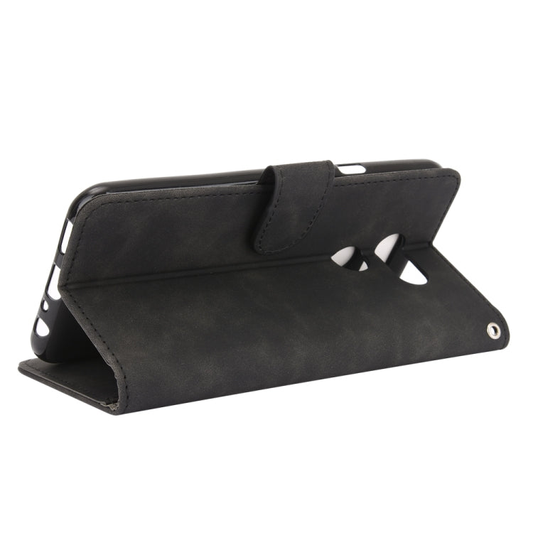 For LG K40S Solid Color Skin Feel Magnetic Buckle Horizontal Flip Calf Texture PU Leather Case with Holder & Card Slots & Wallet