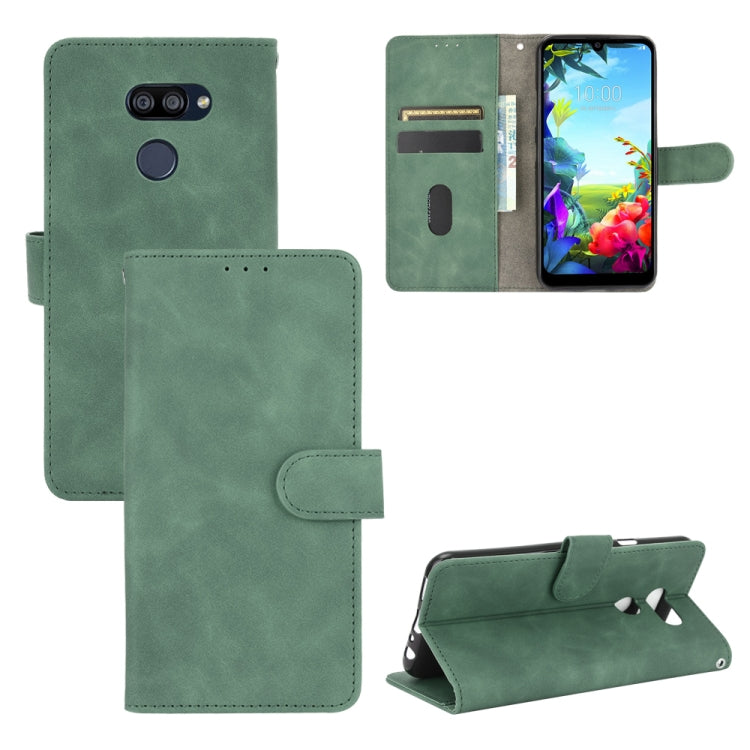For LG K40S Solid Color Skin Feel Magnetic Buckle Horizontal Flip Calf Texture PU Leather Case with Holder & Card Slots & Wallet
