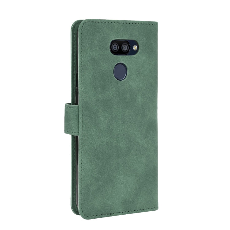 For LG K40S Solid Color Skin Feel Magnetic Buckle Horizontal Flip Calf Texture PU Leather Case with Holder & Card Slots & Wallet