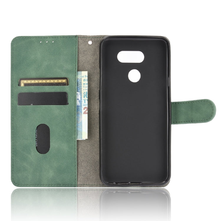 For LG K40S Solid Color Skin Feel Magnetic Buckle Horizontal Flip Calf Texture PU Leather Case with Holder & Card Slots & Wallet