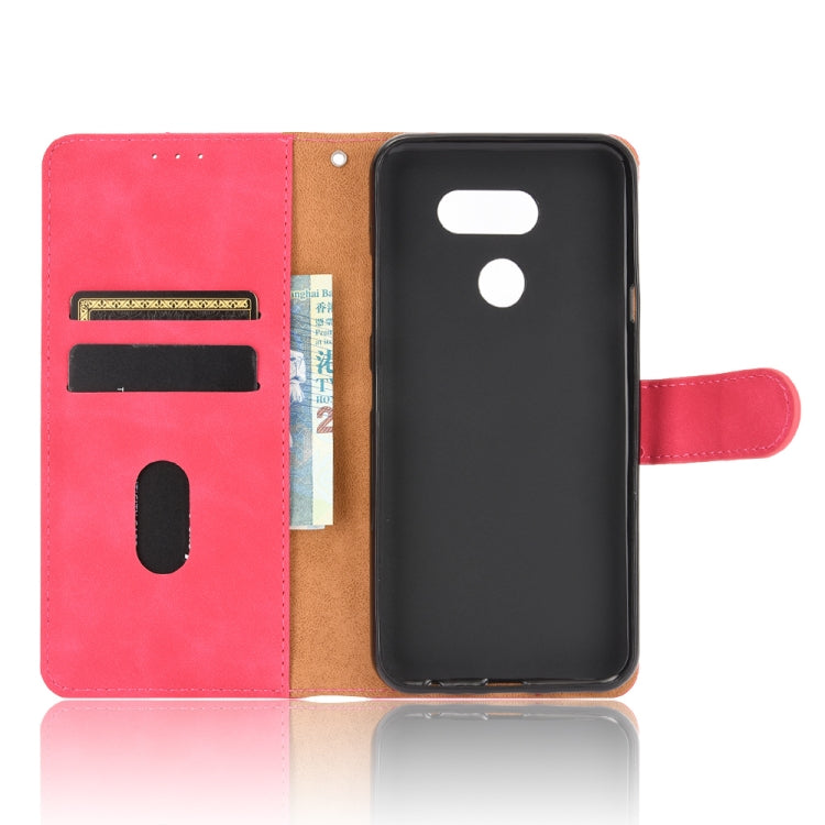 For LG K40S Solid Color Skin Feel Magnetic Buckle Horizontal Flip Calf Texture PU Leather Case with Holder & Card Slots & Wallet