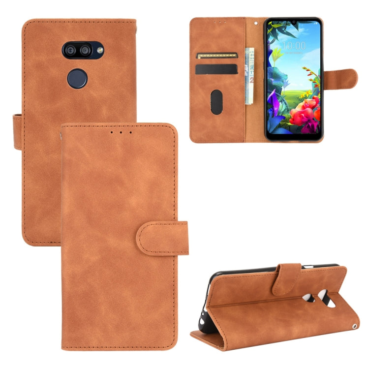 For LG K40S Solid Color Skin Feel Magnetic Buckle Horizontal Flip Calf Texture PU Leather Case with Holder & Card Slots & Wallet