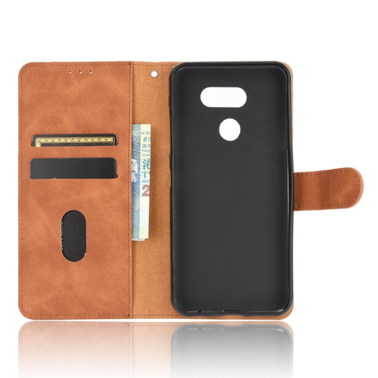 For LG K40S Solid Color Skin Feel Magnetic Buckle Horizontal Flip Calf Texture PU Leather Case with Holder & Card Slots & Wallet