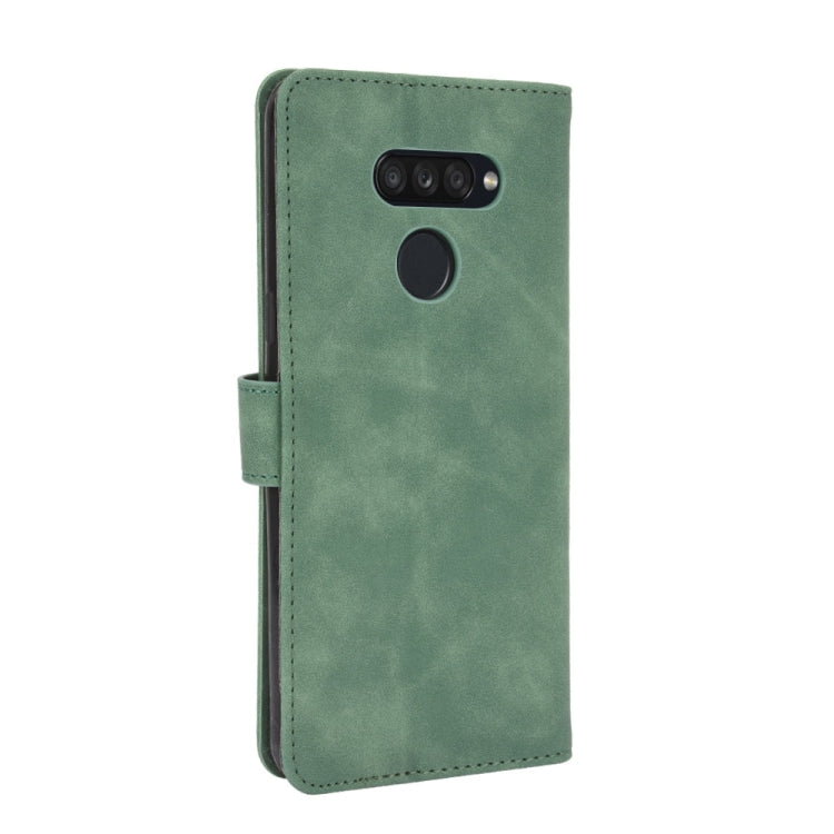 For LG K50S Solid Color Skin Feel Magnetic Buckle Horizontal Flip Calf Texture PU Leather Case with Holder & Card Slots & Wallet