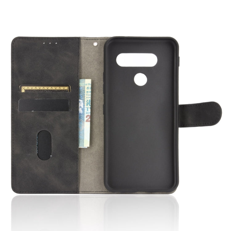 For LG Q70 Solid Color Skin Feel Magnetic Buckle Horizontal Flip Calf Texture PU Leather Case with Holder & Card Slots & Wallet