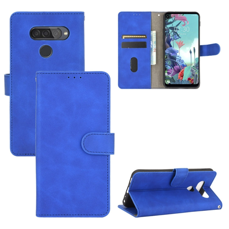 For LG Q70 Solid Color Skin Feel Magnetic Buckle Horizontal Flip Calf Texture PU Leather Case with Holder & Card Slots & Wallet