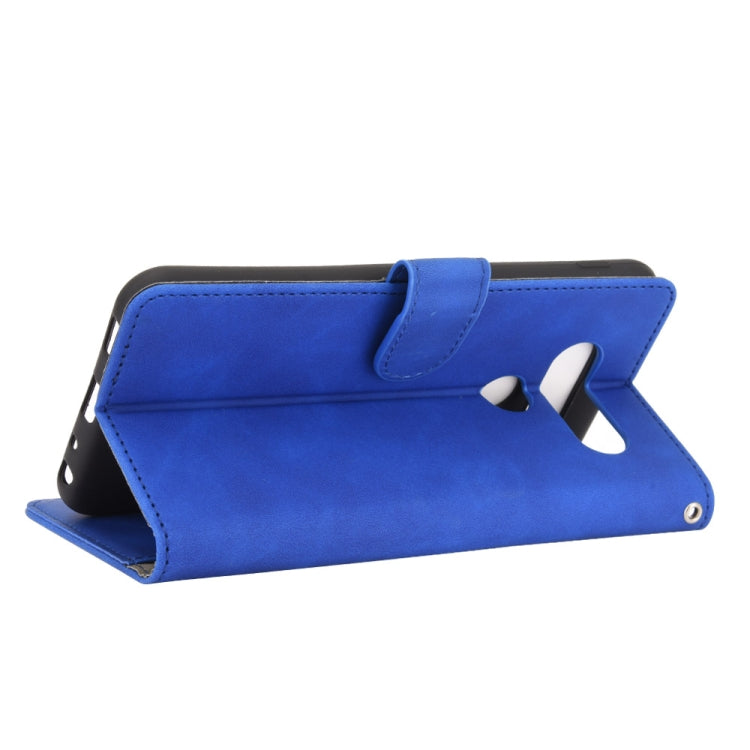 For LG Q70 Solid Color Skin Feel Magnetic Buckle Horizontal Flip Calf Texture PU Leather Case with Holder & Card Slots & Wallet