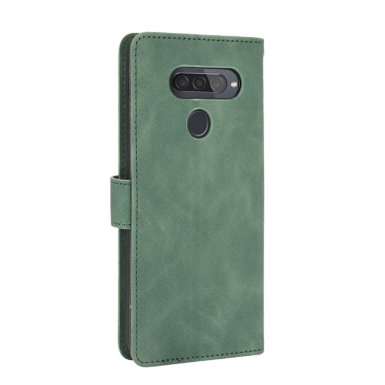 For LG Q70 Solid Color Skin Feel Magnetic Buckle Horizontal Flip Calf Texture PU Leather Case with Holder & Card Slots & Wallet
