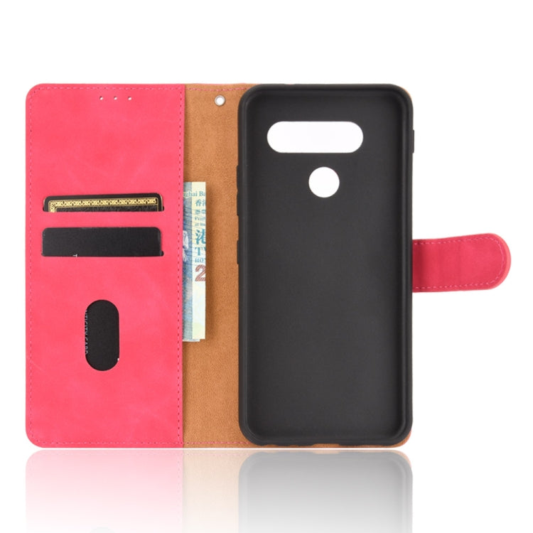 For LG Q70 Solid Color Skin Feel Magnetic Buckle Horizontal Flip Calf Texture PU Leather Case with Holder & Card Slots & Wallet