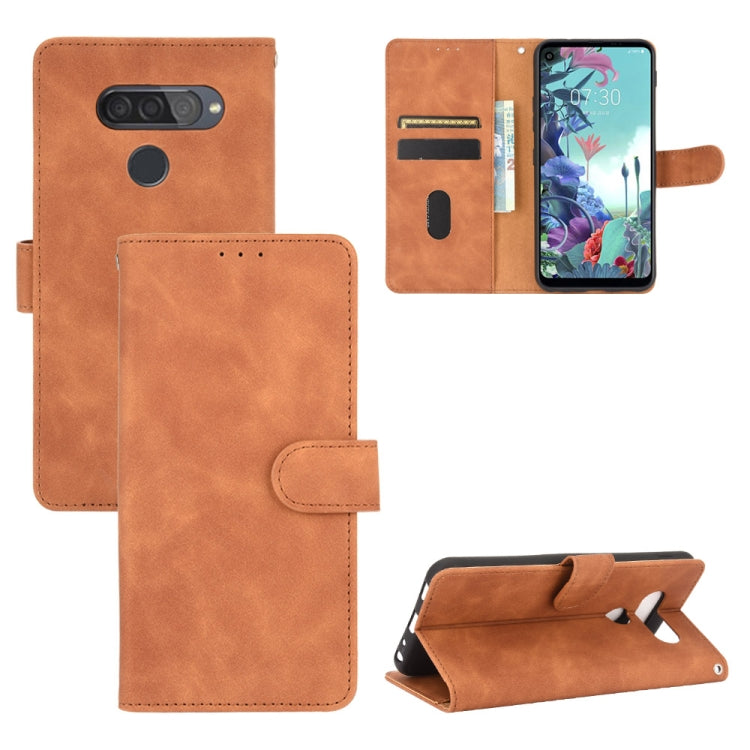 For LG Q70 Solid Color Skin Feel Magnetic Buckle Horizontal Flip Calf Texture PU Leather Case with Holder & Card Slots & Wallet