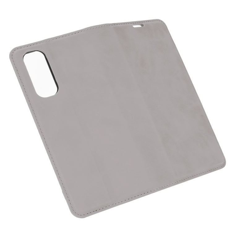 For OPPO Realme 7 Retro-skin Business Magnetic Suction Leather Case with Holder & Card Slots & Wallet