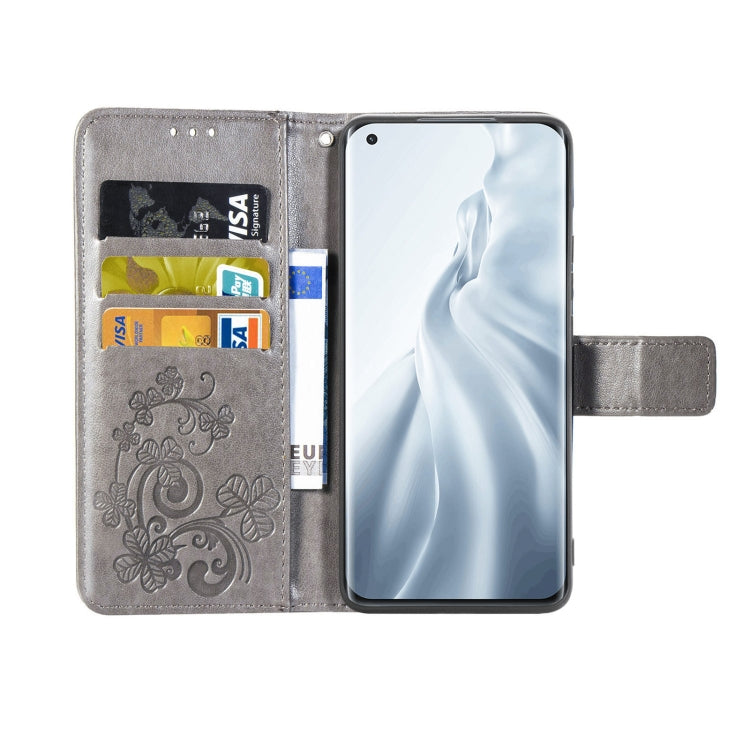 For Xiaomi Mi 11 Four-leaf Clasp Embossed Buckle Mobile Phone Protection Leather Case with Lanyard & Card Slot & Wallet & Bracket Function