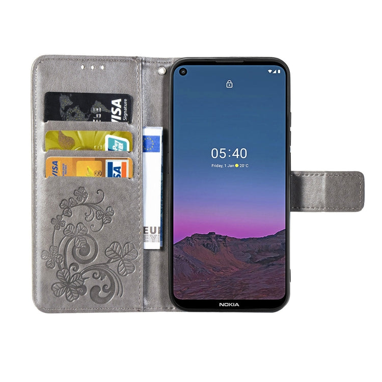 For Nokia 5.4 Four-leaf Clasp Embossed Buckle Mobile Phone Protection Leather Case with Lanyard & Card Slot & Wallet & Bracket Function