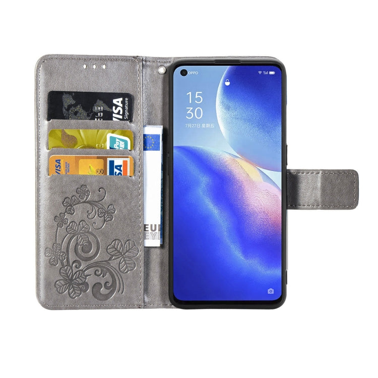 For OPPO Reno5 5G Four-leaf Clasp Embossed Buckle Leather Phone Case with Lanyard & Card Slot & Wallet & Holder