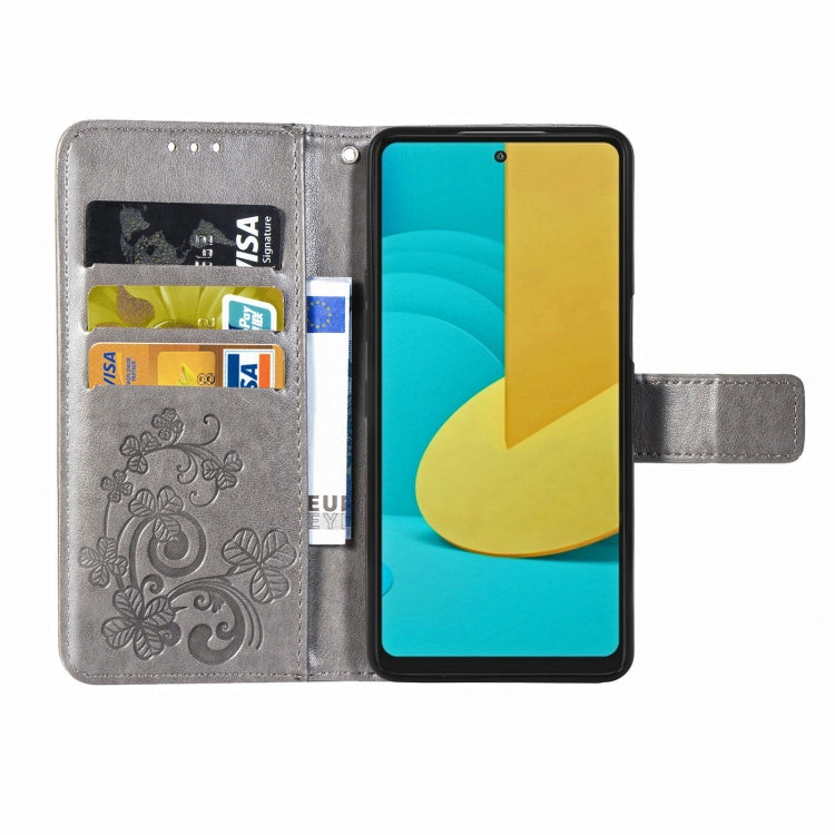For LG Stylo 7 Four-leaf Clasp Embossed Buckle Mobile Phone Protection Leather Case with Lanyard & Card Slot & Wallet & Bracket Function
