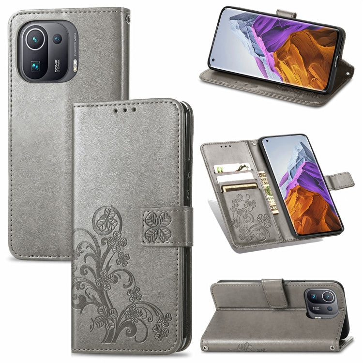 For Xiaomi Mi 11 Pro Four-leaf Clasp Embossed Buckle Mobile Phone Protection Leather Case with Lanyard & Card Slot & Wallet & Bracket Function
