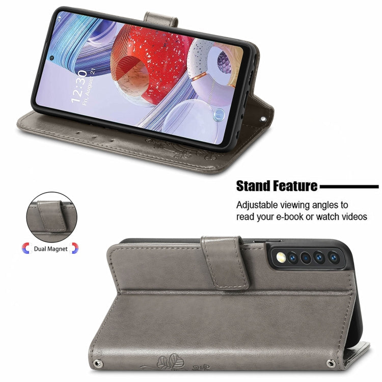 For LG Stylo 7 4G Four-leaf Clasp Embossed Buckle Mobile Phone Protection Leather Case with Lanyard & Card Slot & Wallet & Bracket Function