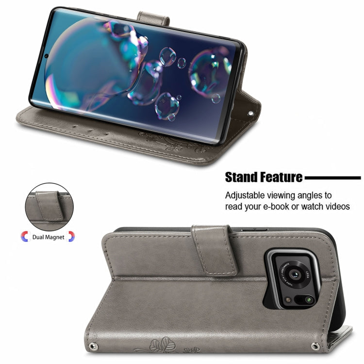 For Sharp R6 Four-leaf Clasp Embossed Buckle Mobile Phone Protection Leather Case with Lanyard & Card Slot & Wallet & Bracket Function