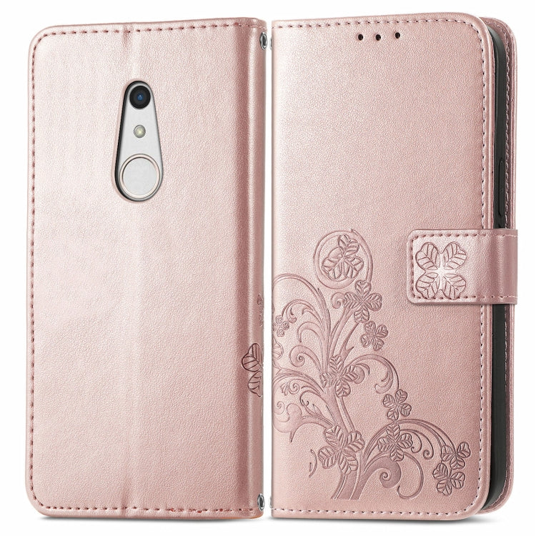 For FUJITSU F-41B Four-leaf Clasp Embossed Buckle Mobile Phone Protection Leather Case with Lanyard & Card Slot & Wallet & Bracket Function