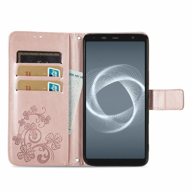 For FUJITSU F-41B Four-leaf Clasp Embossed Buckle Mobile Phone Protection Leather Case with Lanyard & Card Slot & Wallet & Bracket Function