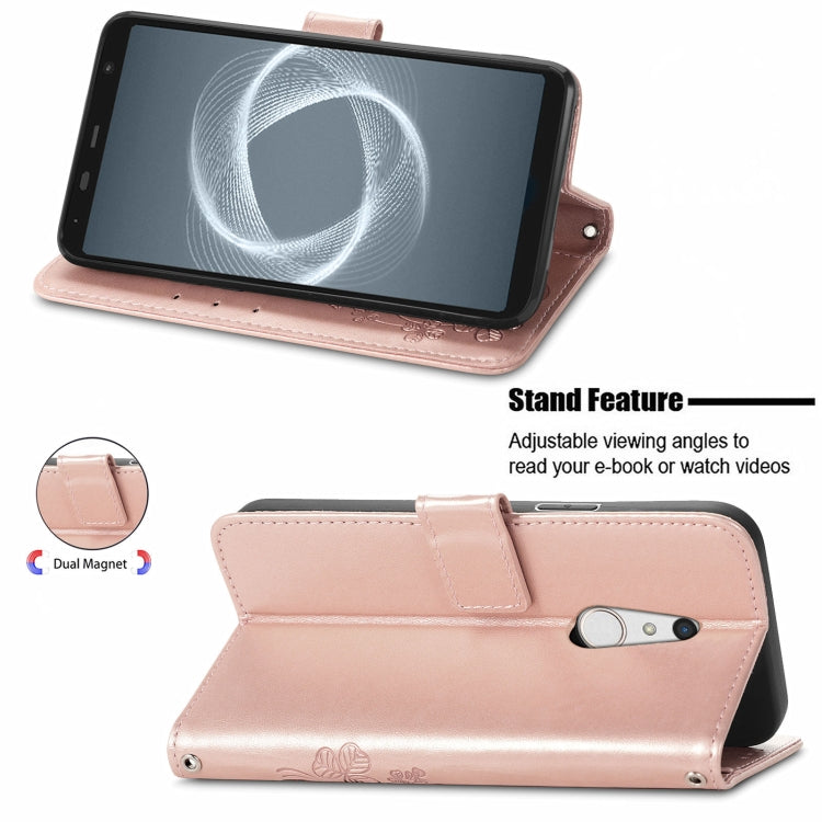 For FUJITSU F-41B Four-leaf Clasp Embossed Buckle Mobile Phone Protection Leather Case with Lanyard & Card Slot & Wallet & Bracket Function