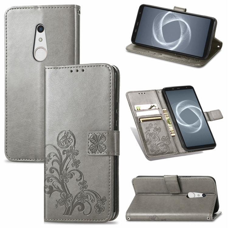 For FUJITSU F-41B Four-leaf Clasp Embossed Buckle Mobile Phone Protection Leather Case with Lanyard & Card Slot & Wallet & Bracket Function