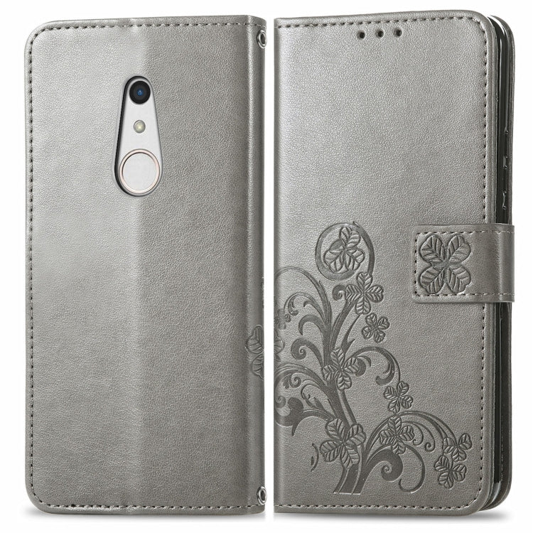 For FUJITSU F-41B Four-leaf Clasp Embossed Buckle Mobile Phone Protection Leather Case with Lanyard & Card Slot & Wallet & Bracket Function