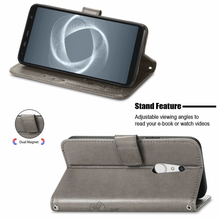 For FUJITSU F-41B Four-leaf Clasp Embossed Buckle Mobile Phone Protection Leather Case with Lanyard & Card Slot & Wallet & Bracket Function