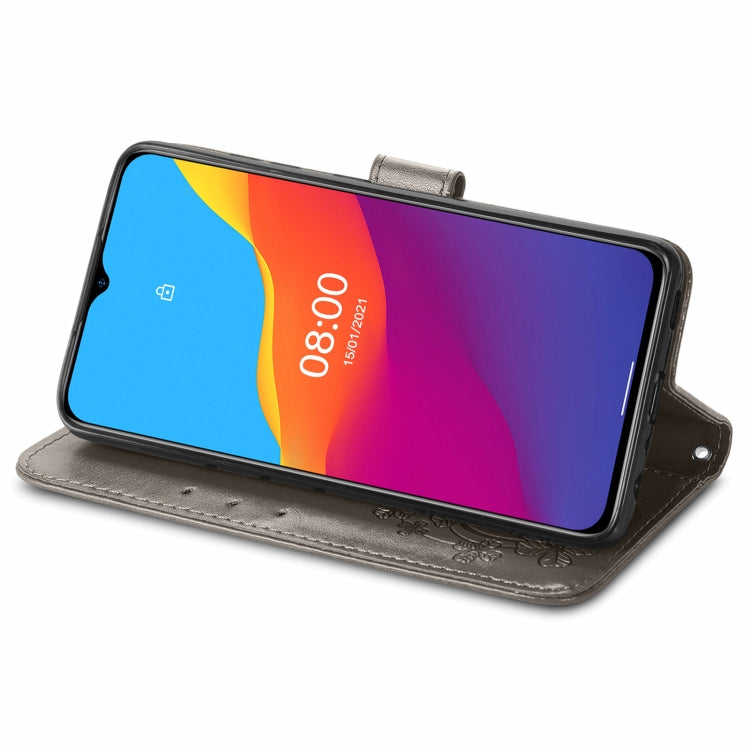 For Ulefone Note 10 Four-leaf Clasp Embossed Buckle Mobile Phone Protection Leather Case with Lanyard & Card Slot & Wallet & Bracket Function