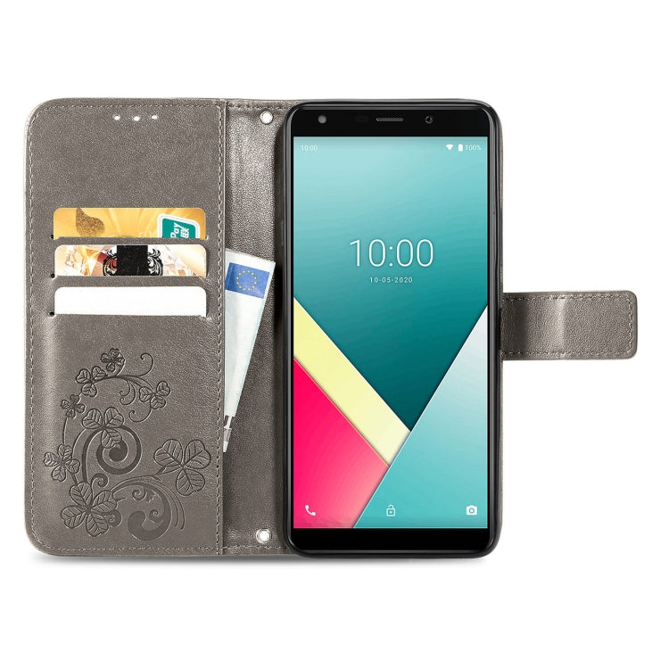 For Wiko Y61 Four-leaf Clasp Embossed Buckle Mobile Phone Protection Leather Case with Lanyard & Card Slot & Wallet & Bracket Function