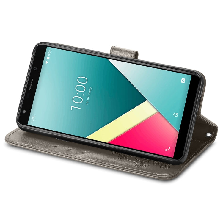 For Wiko Y61 Four-leaf Clasp Embossed Buckle Mobile Phone Protection Leather Case with Lanyard & Card Slot & Wallet & Bracket Function