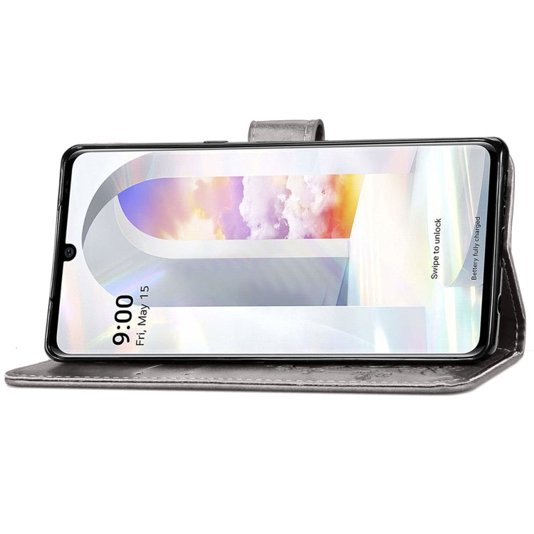 For LG Velvet 2 Pro Four-leaf Clasp Embossed Buckle Mobile Phone Protection Leather Case with Lanyard & Card Slot & Wallet & Bracket Function