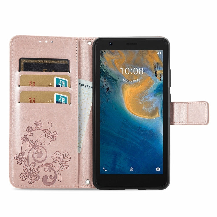 For ZTE Blade A31 Lite Four-leaf Clasp Embossed Leather Case with Lanyard & Card Slot & Wallet & Holder