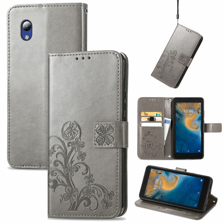 For ZTE Blade A31 Lite Four-leaf Clasp Embossed Leather Case with Lanyard & Card Slot & Wallet & Holder