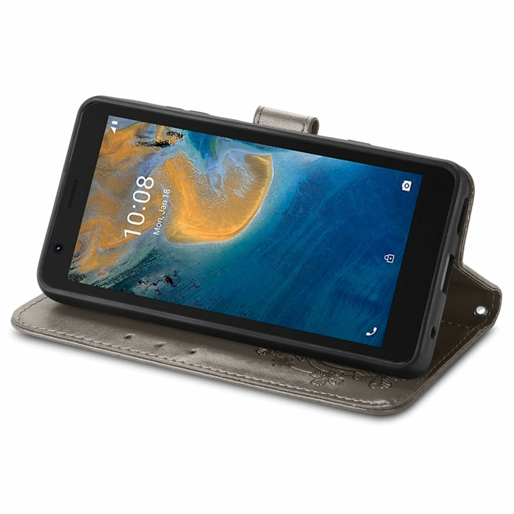 For ZTE Blade A31 Lite Four-leaf Clasp Embossed Leather Case with Lanyard & Card Slot & Wallet & Holder