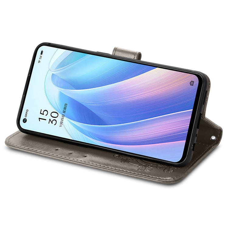 For OPPO Reno7 5G Four-leaf Clasp Embossed Buckle Leather Phone Case