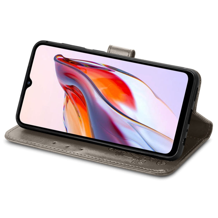 For Xiaomi Redmi 12C Four-leaf Clasp Embossed Buckle Leather Phone Case