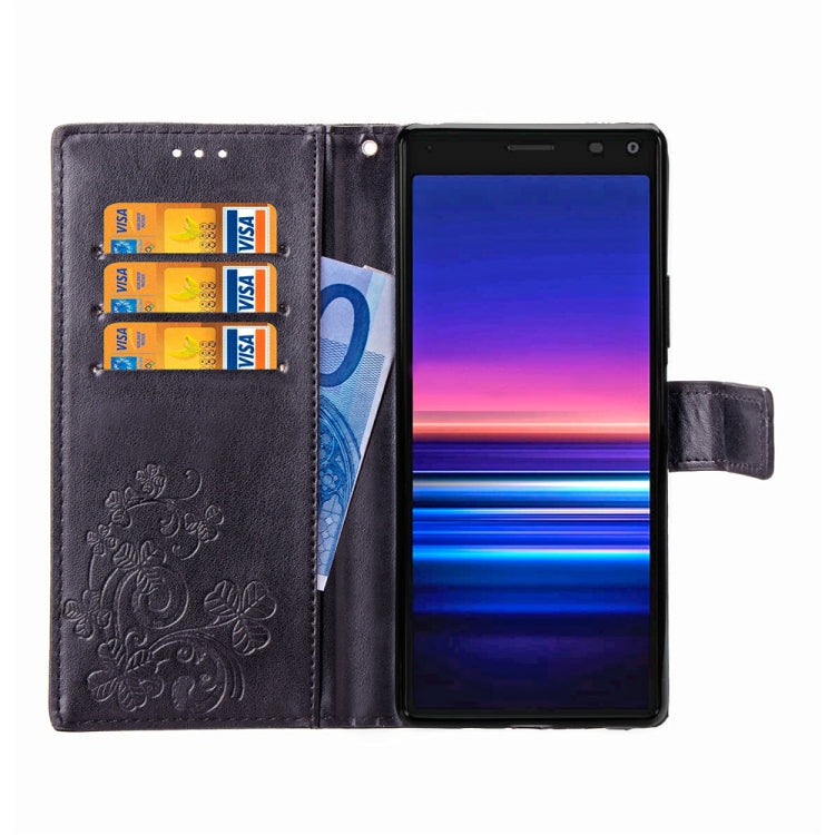 For Sony Xperia 20 Four-leaf Clasp Embossed Buckle Mobile Phone Protection Leather Case with Lanyard & Card Slot & Wallet & Bracket Function