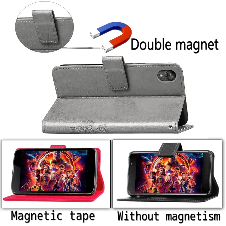 For Moto E6 Four-leaf Clasp Embossed Buckle Mobile Phone Protection Leather Case with Lanyard & Card Slot & Wallet & Bracket Function