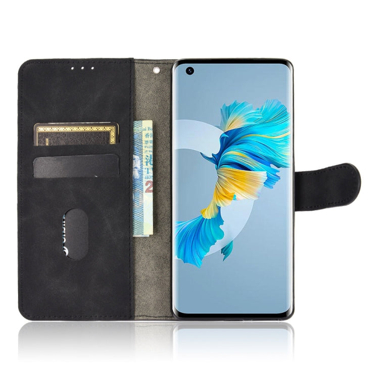 For Huawei Mate 40 Solid Color Skin Feel Magnetic Buckle Horizontal Flip Calf Texture PU Leather Case with Holder & Card Slots & Wallet