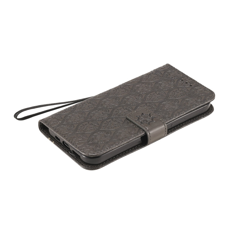 For iPhone 12 / 12 Pro Pressed Printing Rattan Flower Pattern Horizontal Flip PU Leather Case with Holder & Card Slots & Wallet & Photo Frame