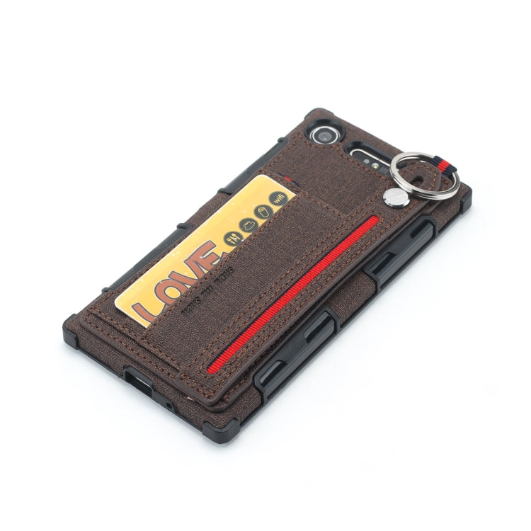 For Sony Xperia XZ1 Cloth Texture + TPU Shockproof Protective Case with Metal Ring & Holder & Card Slots & Hanging Strap